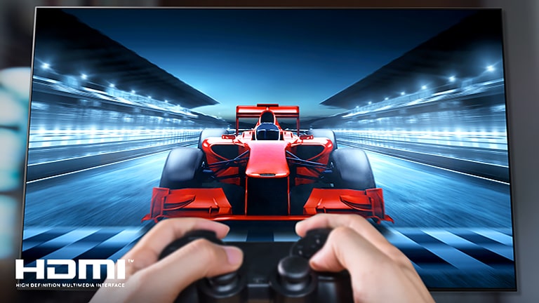 A close up of a player playing a racing game on a TV screen. On the image, there are HDMI logo on the bottom left.