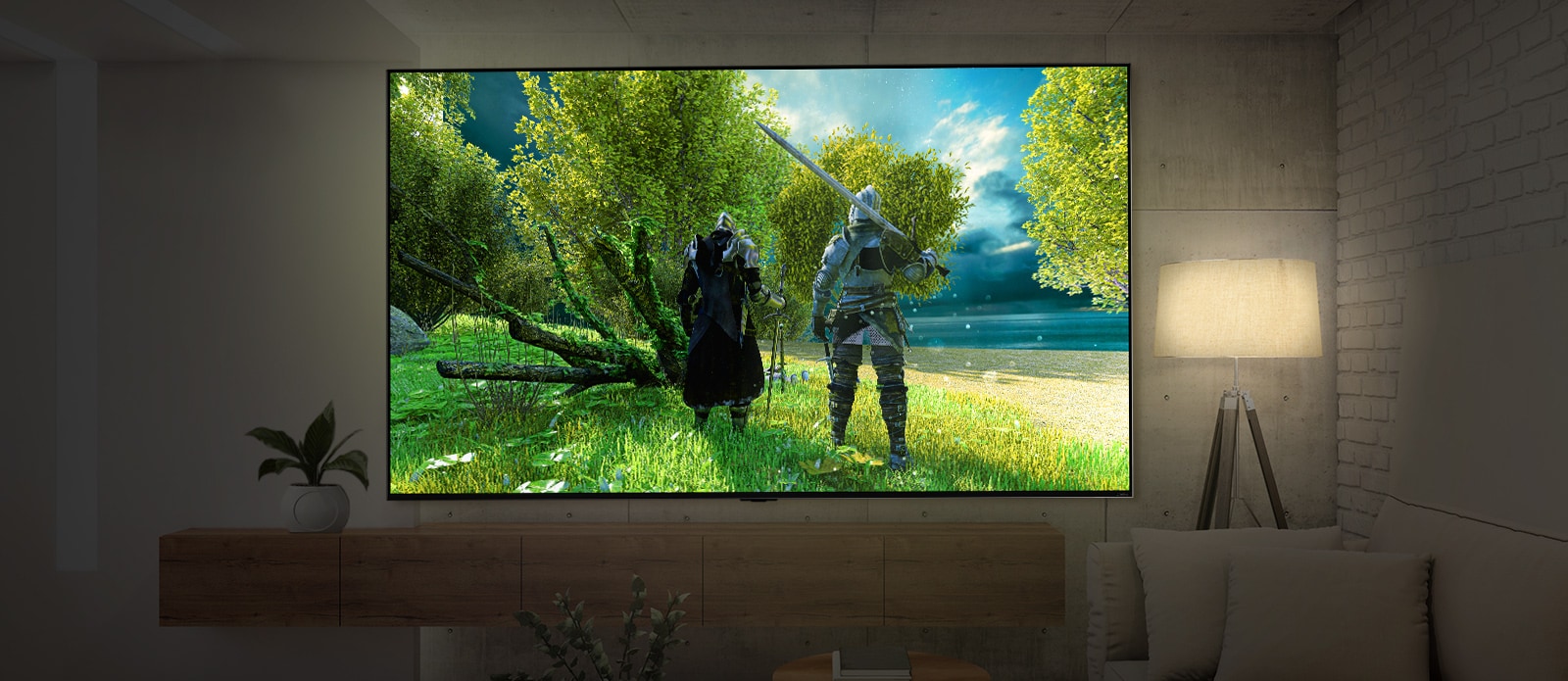 A large-screen TV mounted on a wall in a dark room. The scene shows a rear view of two characters wearing armor.