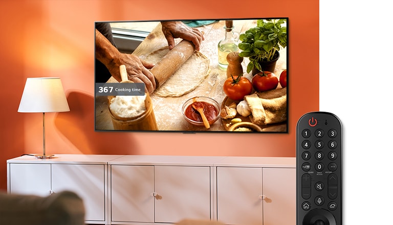 As the voice command button activates and command to find a recipe for homemade pizza, the TV provides a pizza making video. (play the video)