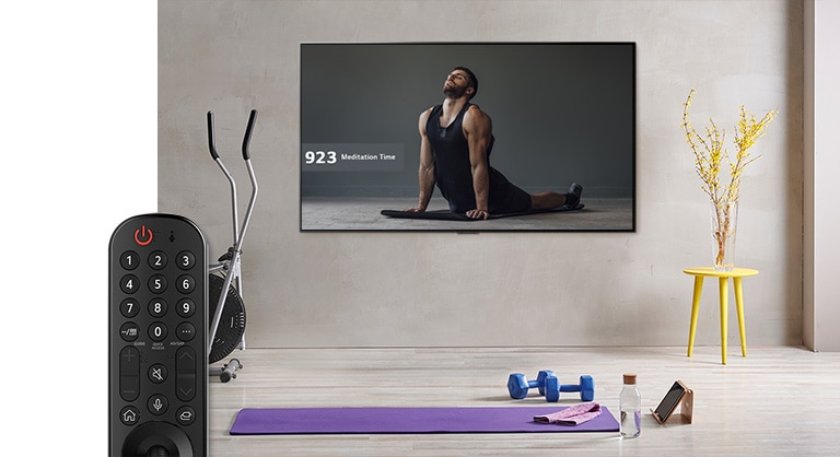 As the voice command button activates and command to find a yoga video, the TV suggests various yoga videos and select a video that a man doing yoga. (play the video)