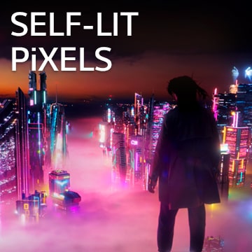 A woman looking down the cityscape with colorful neon signs at night.